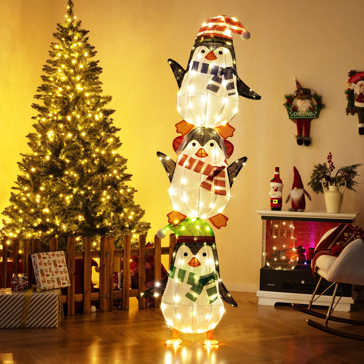 Decoración de pingüinos iluminados con luces blancas cálidas y sombreros bonitos