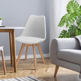 Juego de 4 sillas de comedor modernas de mediados de siglo con asiento de PU de carcasa y patas de madera
