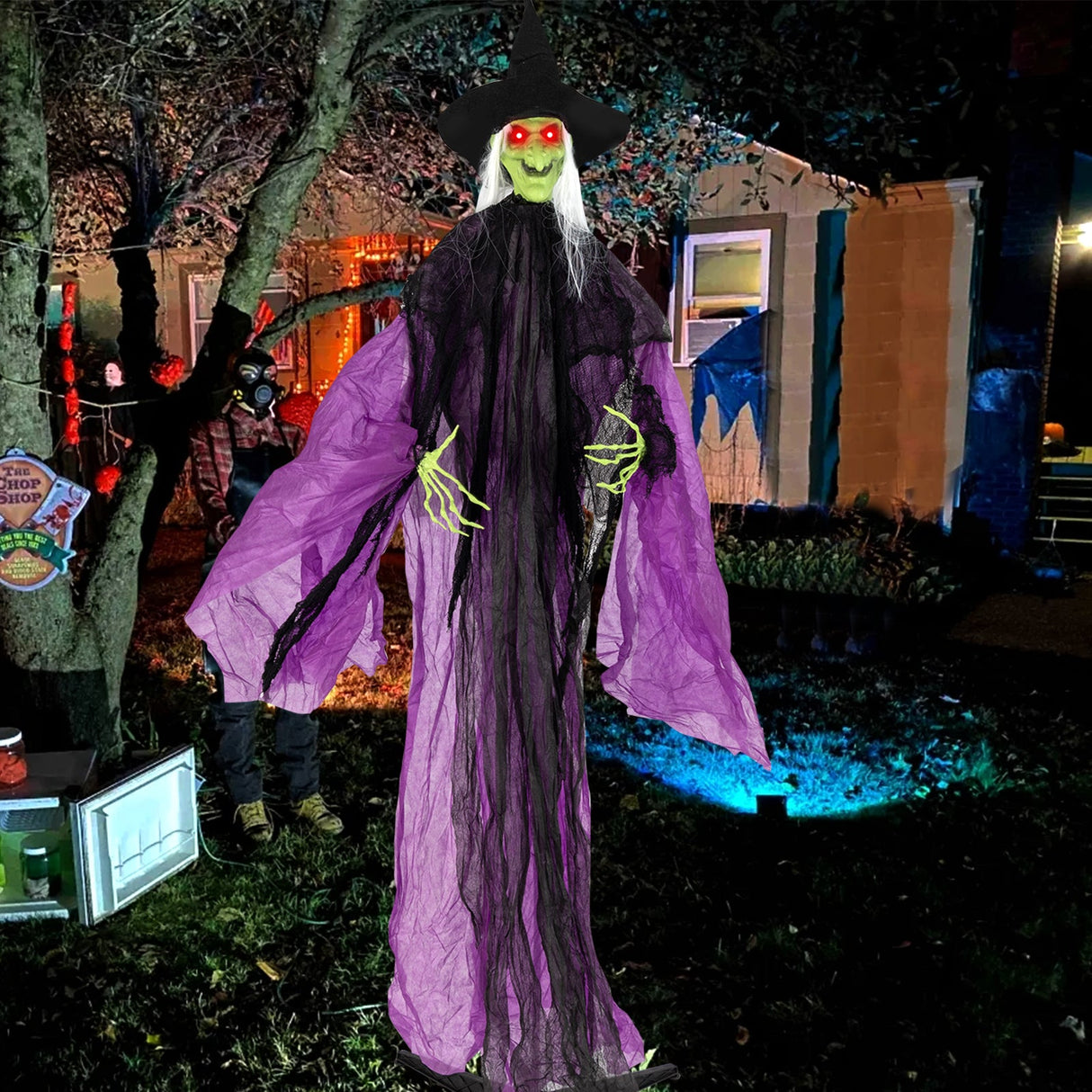 Bruja de Halloween de 2.19 m con ojos iluminados y movimiento automático de brazos