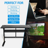 Escritorio de juegos neumático de altura ajustable en forma de T con bandeja para regleta - Negro