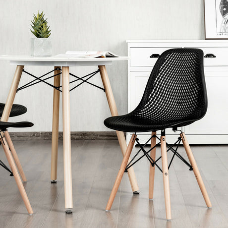 Juego de 2 sillas modernas de plástico huecas con patas de madera