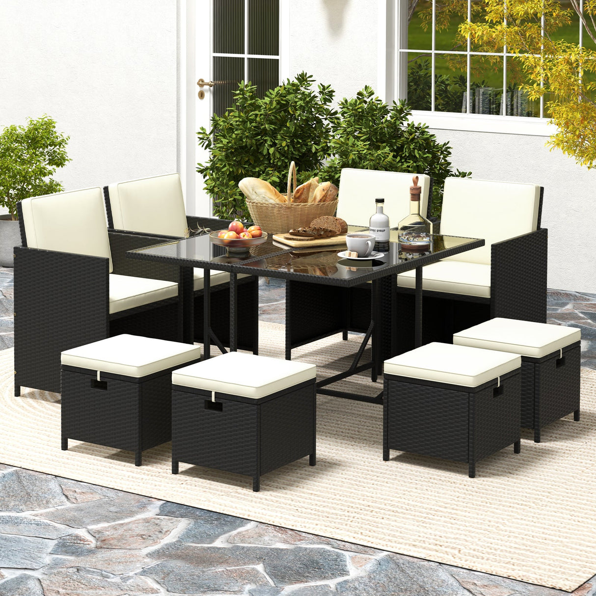 Juego de Muebles de Comedor para Exteriores de 9 Piezas con Mesa de Vidrio Templado y Otomanas-Blanco