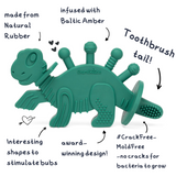 Dibly - Verde - Mordedor de dinosaurio de caucho natural y ámbar báltico con cola de cepillo de dientes