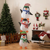 Decoración de pingüinos iluminados con luces blancas cálidas y sombreros bonitos