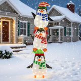 Decoración de pingüinos iluminados con luces blancas cálidas y sombreros bonitos