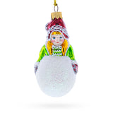 Girl Making a Snowball Glass Christmas Ornament