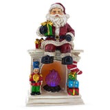 Santa Sitting on a Fireplace LED Lights Figurine 7.75 Inches
