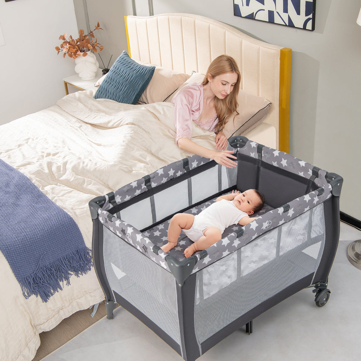Parque de juegos portátil para bebés con cambiador, moisés y caja de música