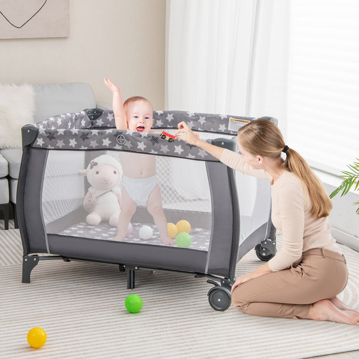 Parque de juegos portátil para bebés con cambiador, moisés y caja de música