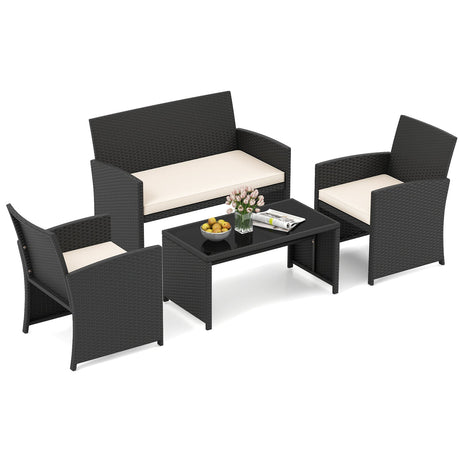 Juego de muebles de patio de 4 piezas con mesa de vidrio templado y cojines extraíbles
